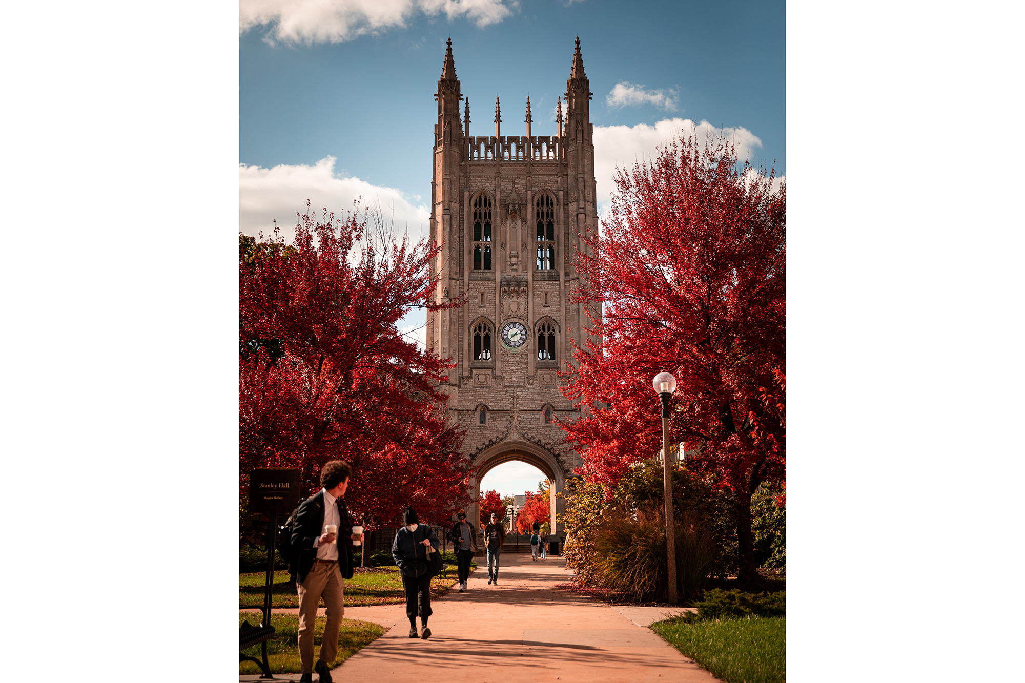 fall photo of memorial union tower and red trees