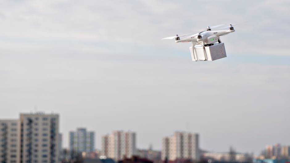 Picture of a drone delivering a package Source Shutterstock