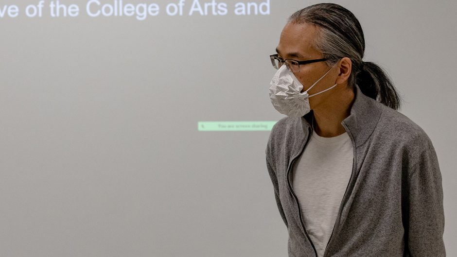 ted chiang wearing a face covering, speaking to a class