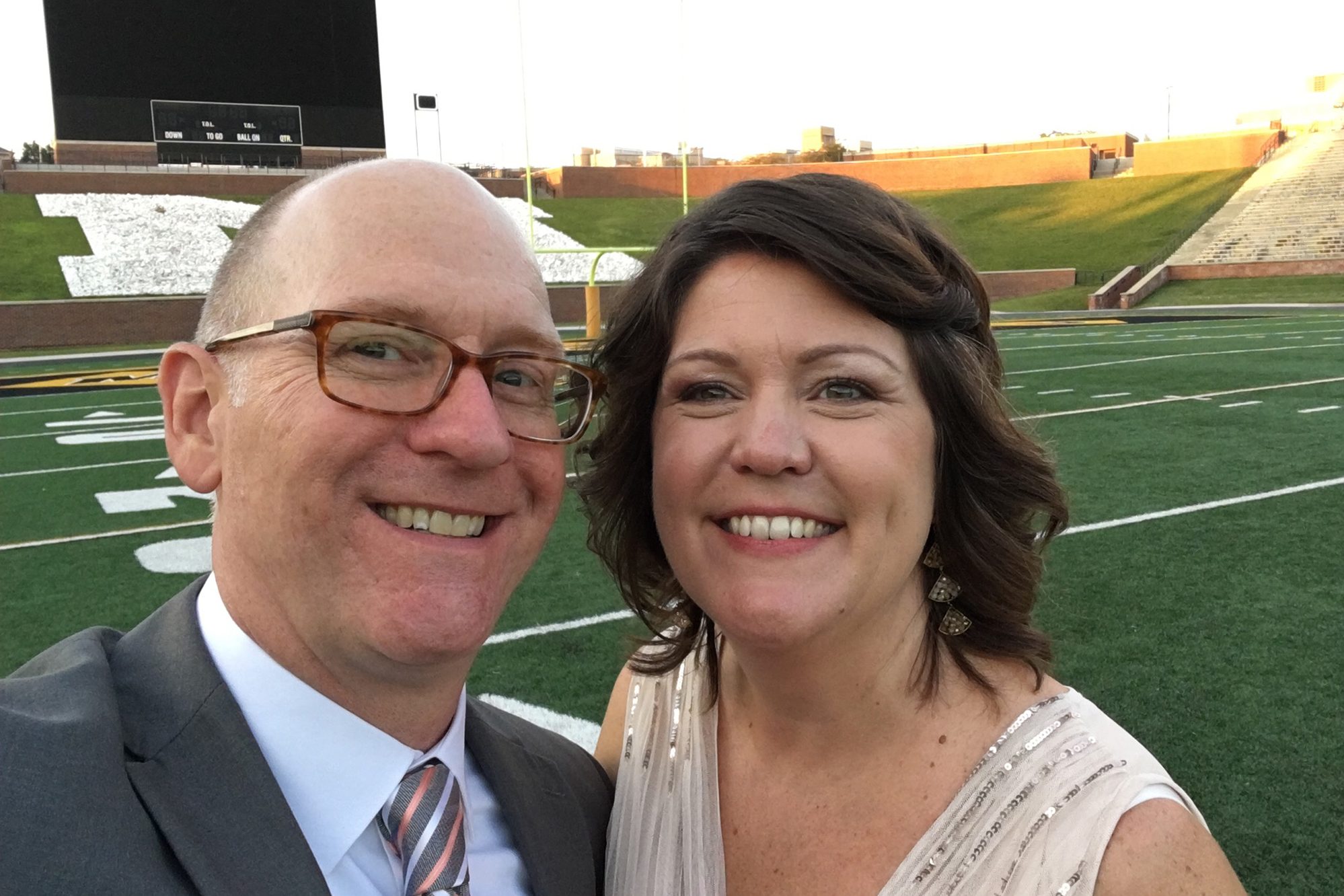 Megan and Stan Silvey pose for a photo after their wedding on faurot field