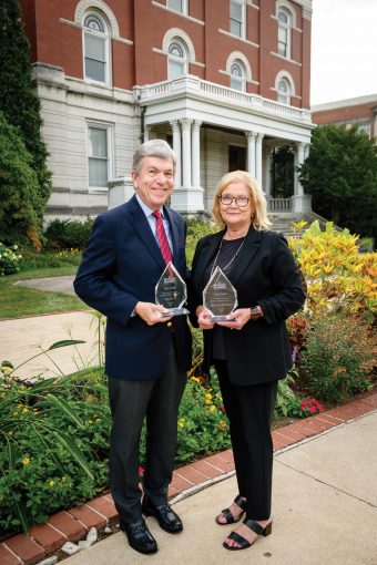 portrait of Roy Blunt and Mary Anne McCollum holding awards