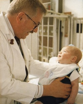 Dr. Ted Groshong holding baby