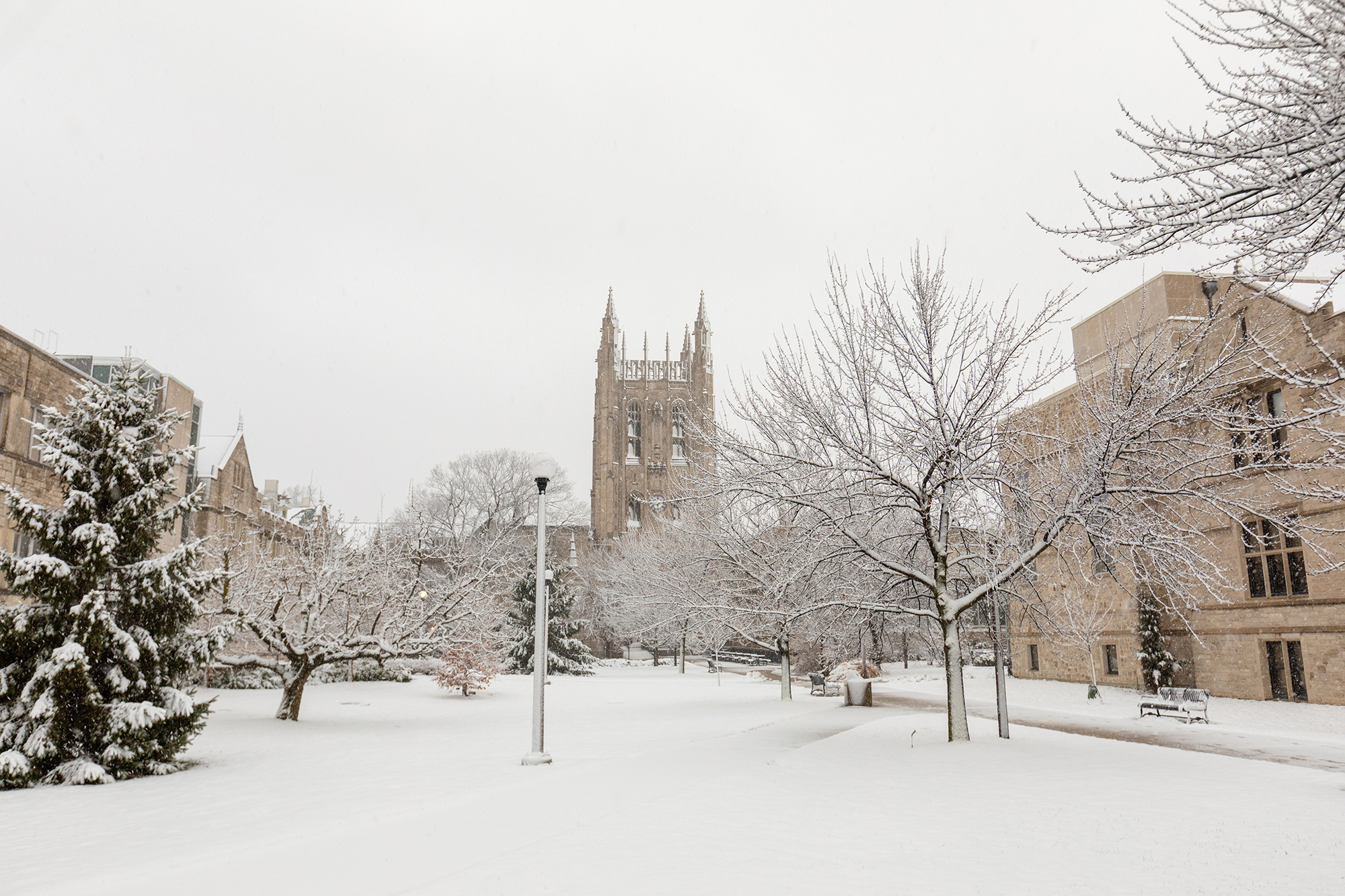 snow-covered campus with memorial union in the back