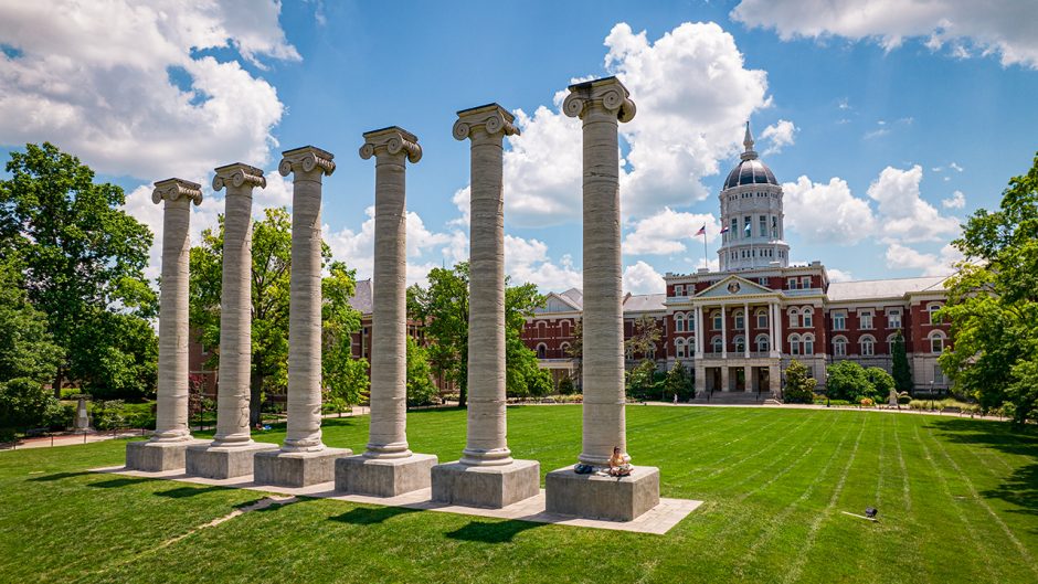 jesse hall on a sunny day with the columns in front of it