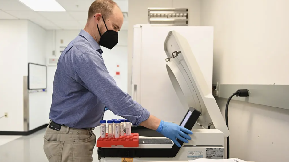 a man working with samples in a lab
