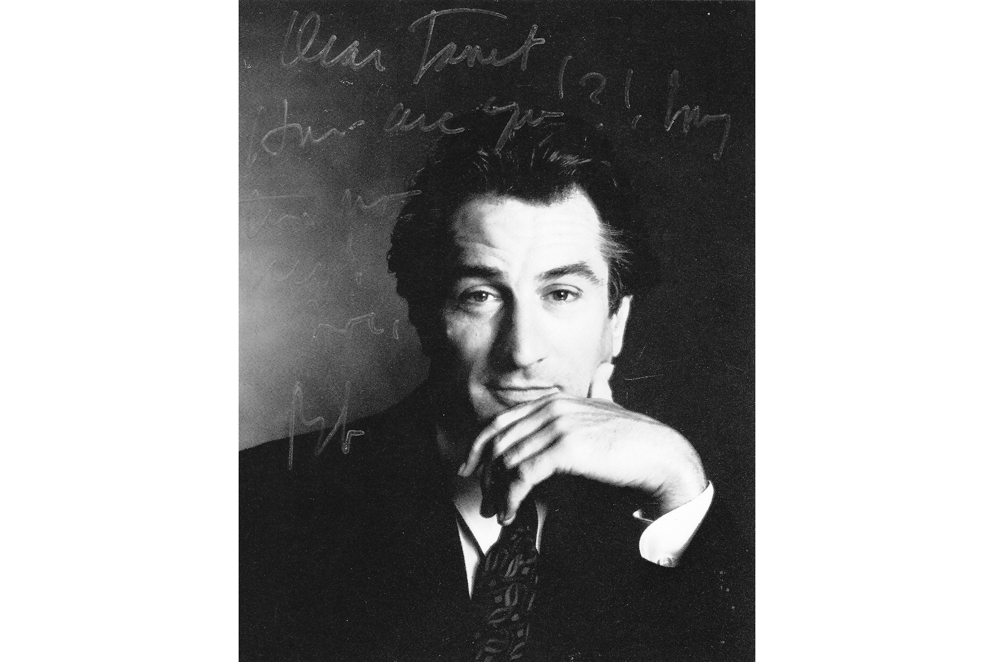 a headshot of robert dinero with an autograph and note to janet