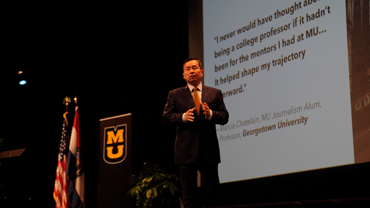 This is an image of MU President Mun Choi explaining the story of someone that was inspired by MU Faculty.