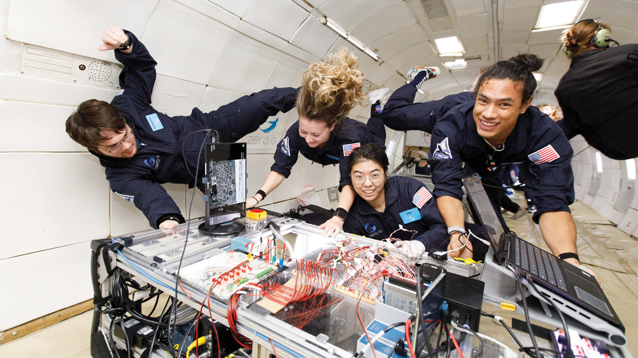 students floating in zero gravity