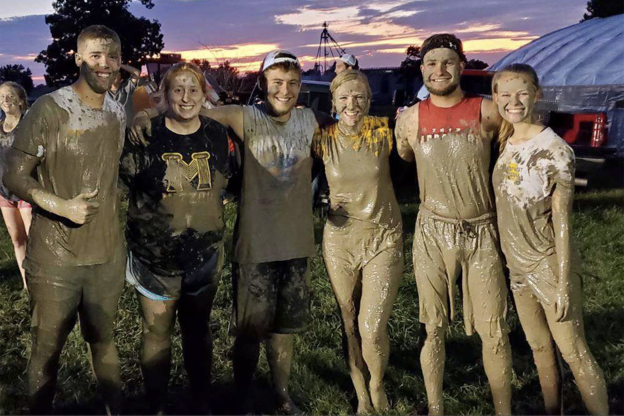 Elizabeth Fahrmeier and friends after a mud volleyball event