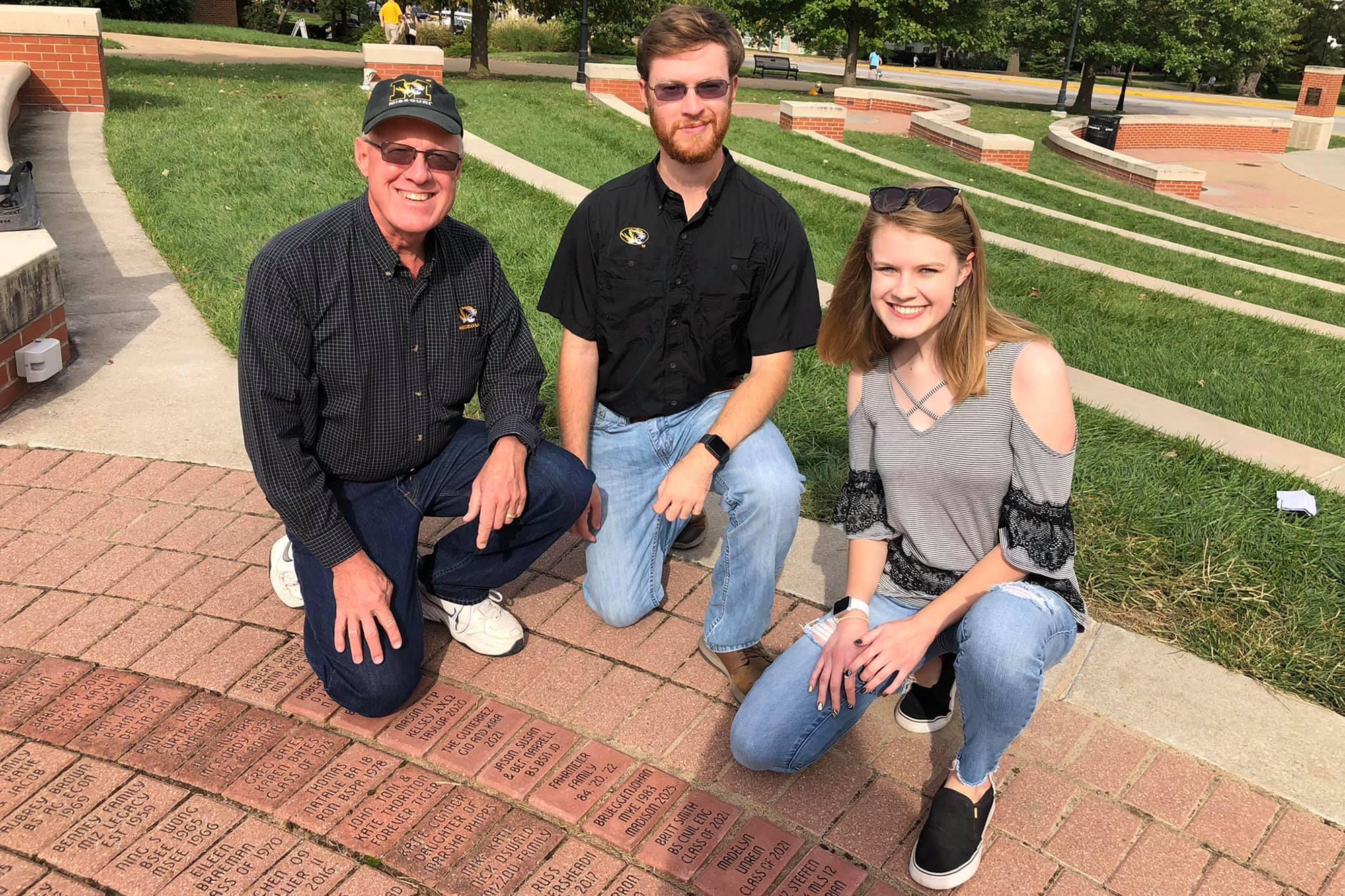 Elizabeth Fahrmeier and her dad and brother at traditions plaza