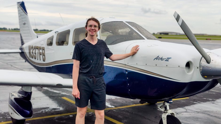 Kobi Ioni poses next to an airplane