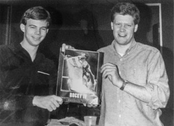 vintage photo of two students holding poster