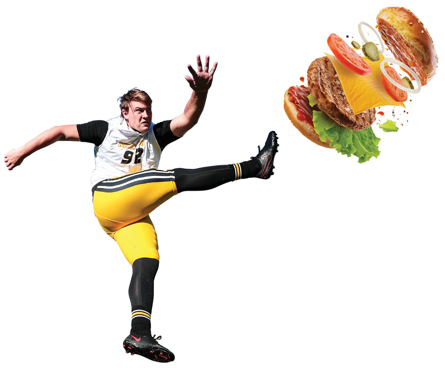 football player kicking hamburger