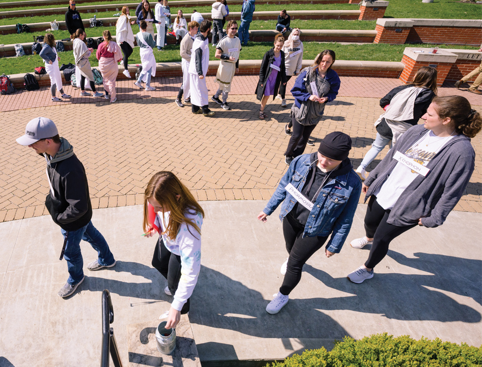 students reenacting trial of Socrates outdoors on campus