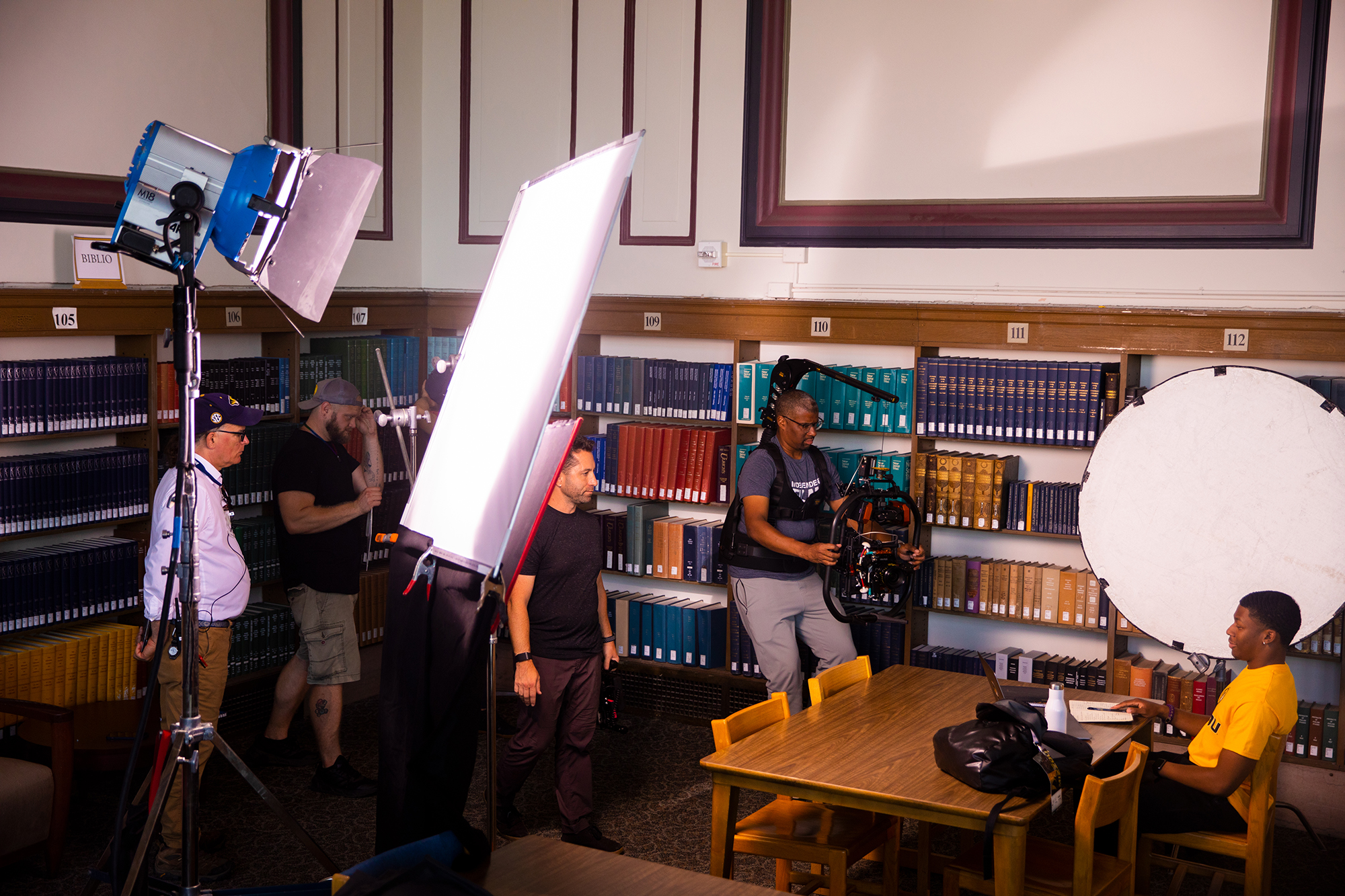 Iconic locations all over campus were used in filming. Here, Haughton gets ready for a close-up in Ellis Library.