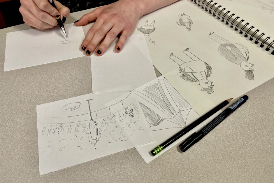 Closeup of student drawing comics