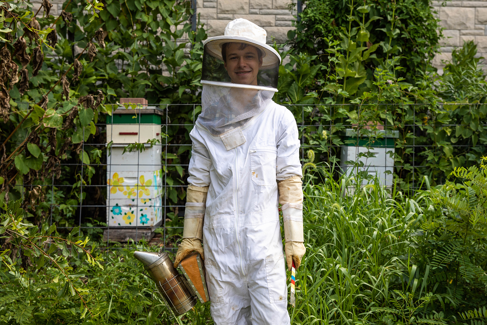 george frees environmental portrait - he's in beekeeping attire