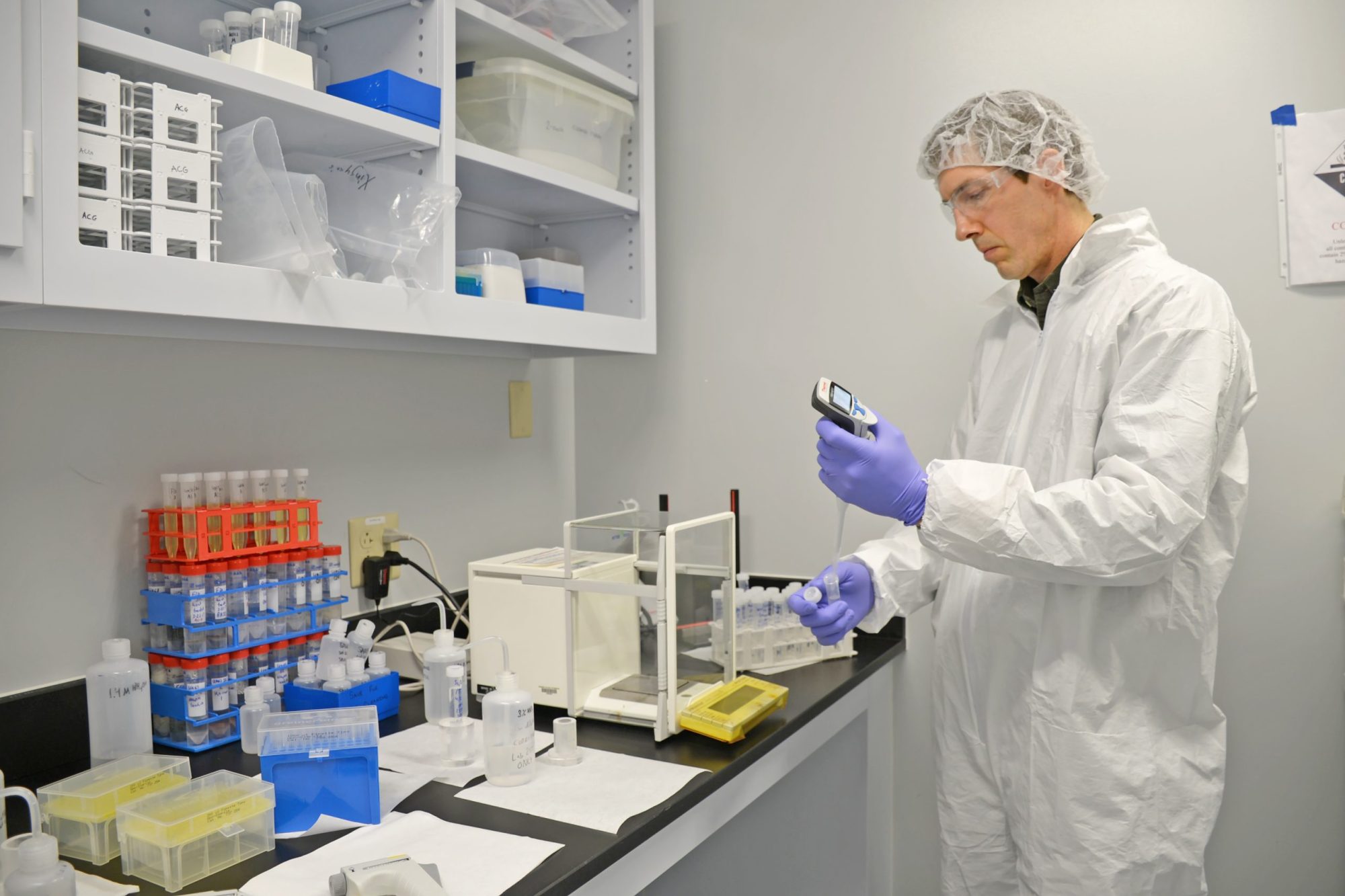 A chemist at the University of Missouri Research Reactor (MURR) prepares samples for analysis.