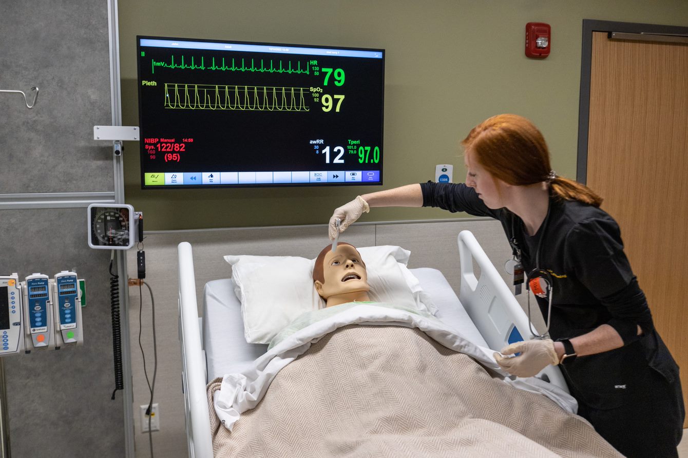 Nursing student using the simulation lab.
