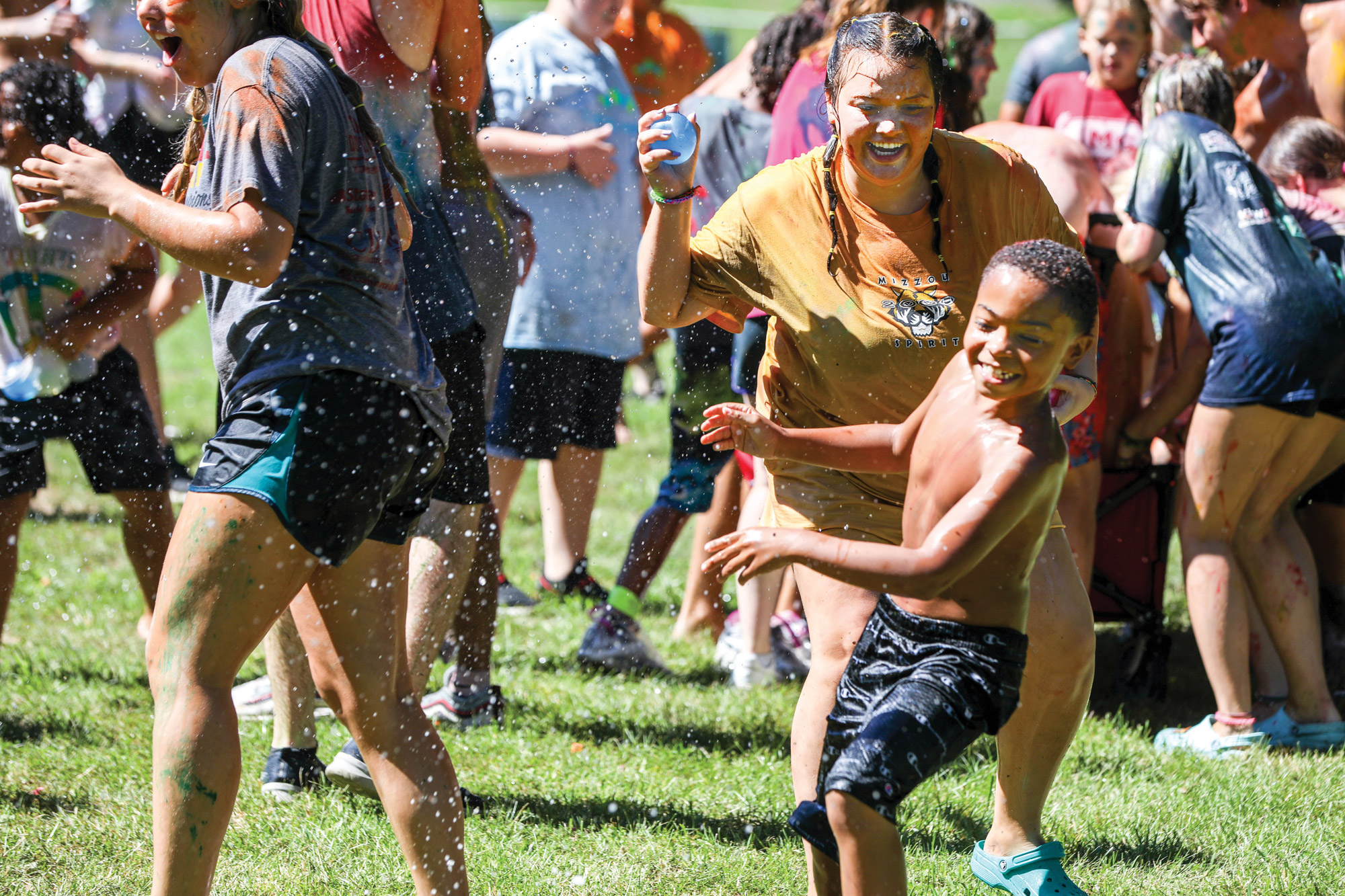 MU students and campers in a water balloon fight