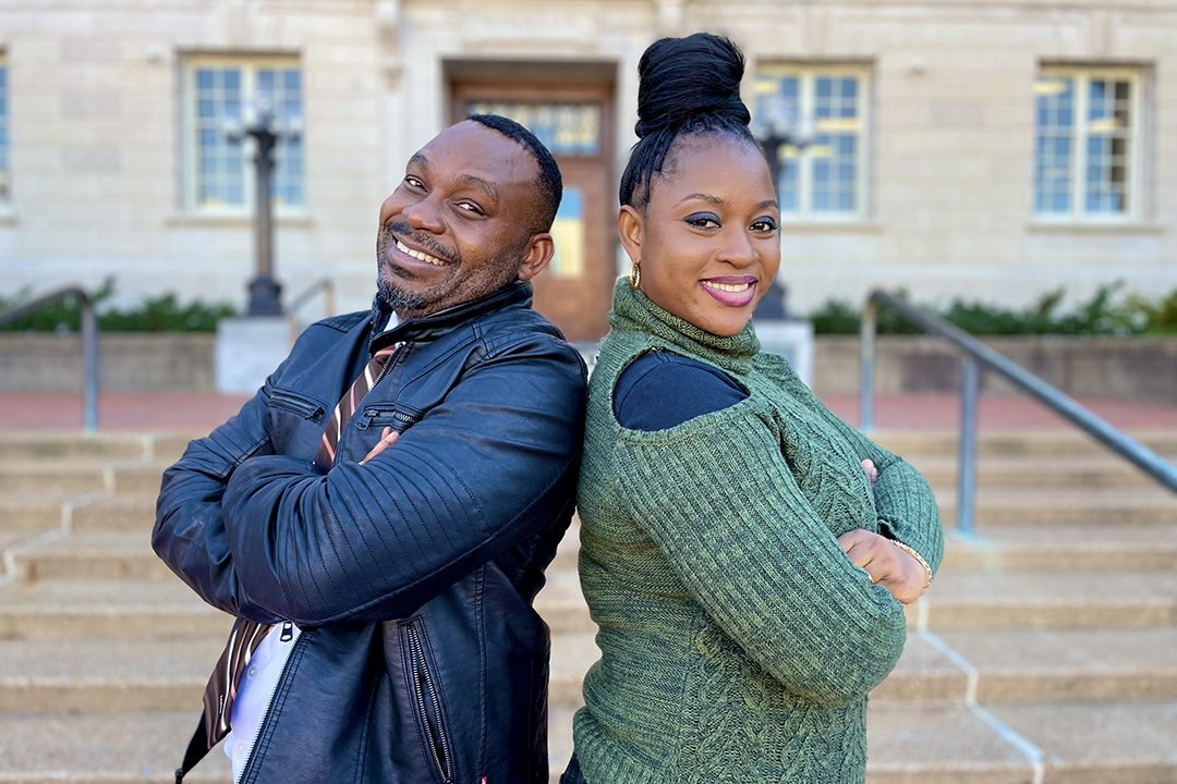 Jessica and Osasu Osaze pose in front of MU's Ellis Library.
