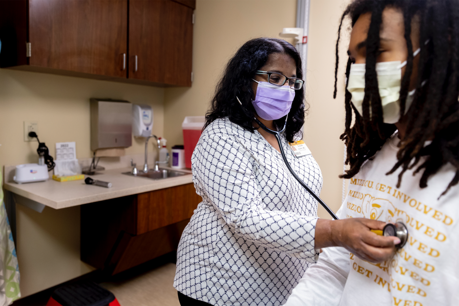 A provider treats a patient at the MU Student Health Center