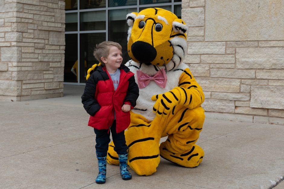 truman and a young tiger fan outside