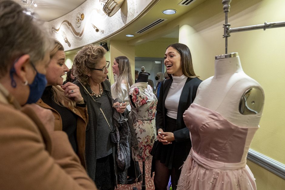 Jenna Lene presents her dress at the Chancellor's Arts Showcase