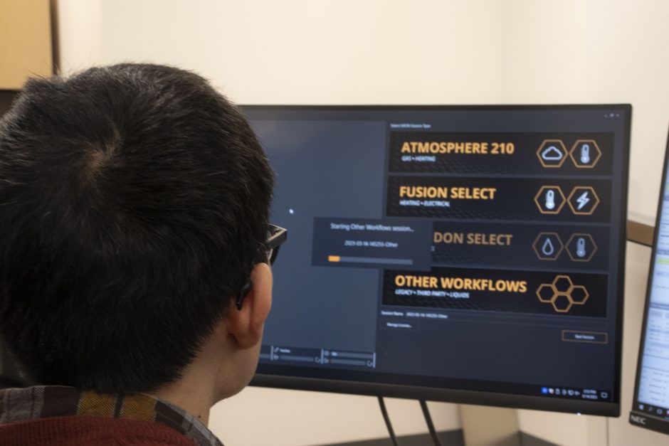 person looks at a computer screen