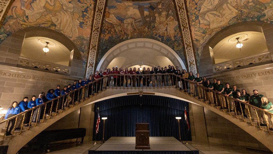 students pose for a large group photo in the capitol