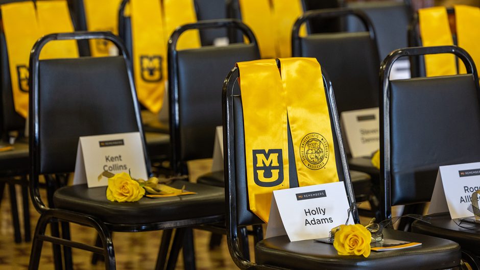 empty chairs with yellow roses on them. some have yellow stoles as well