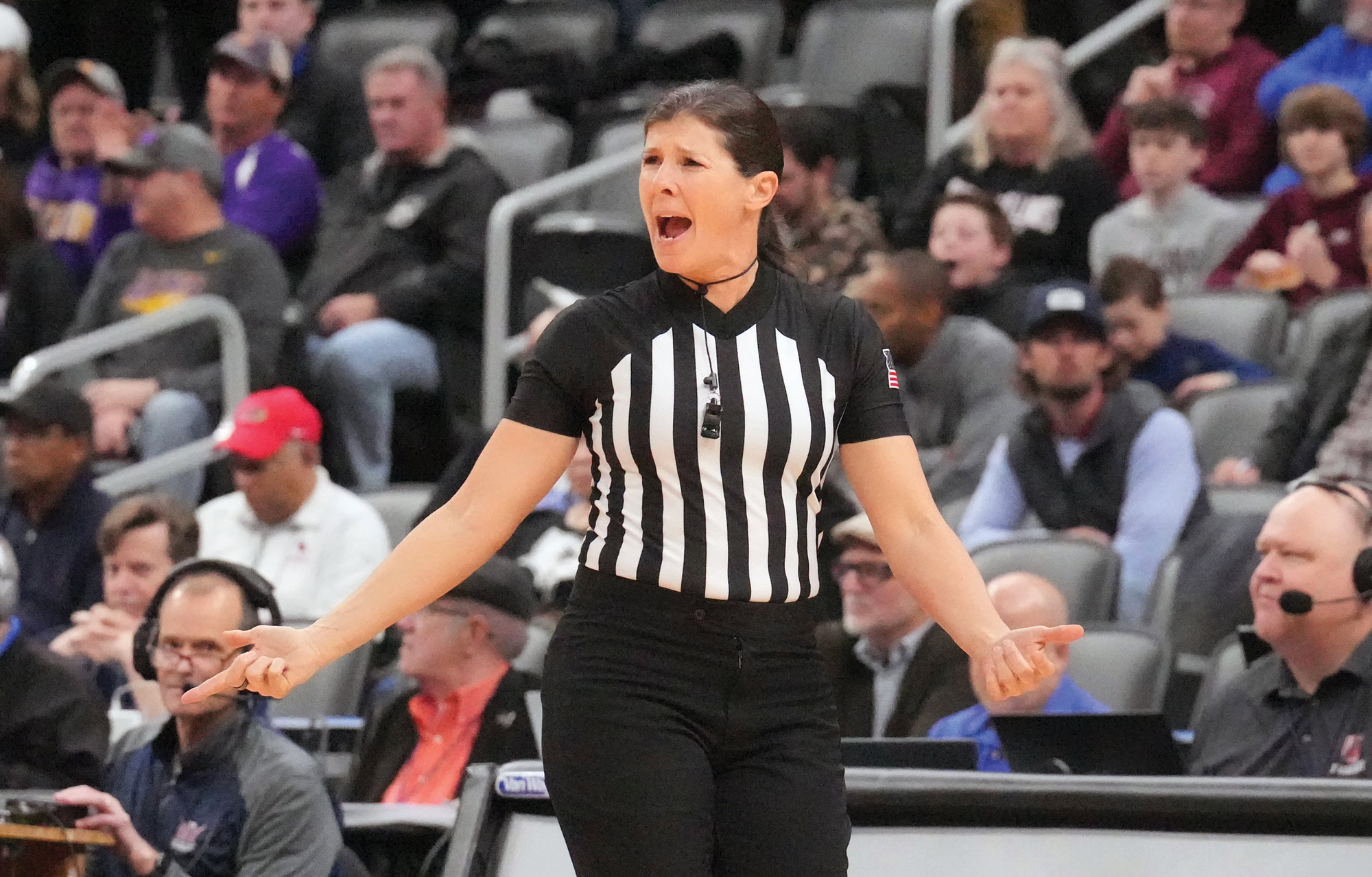 woman refereeing basketball