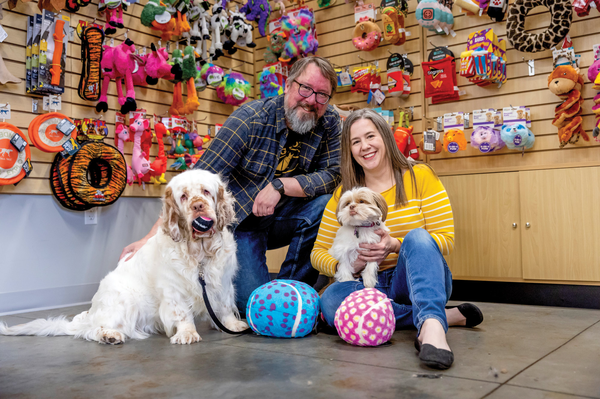 Couple with dogs at a pet store