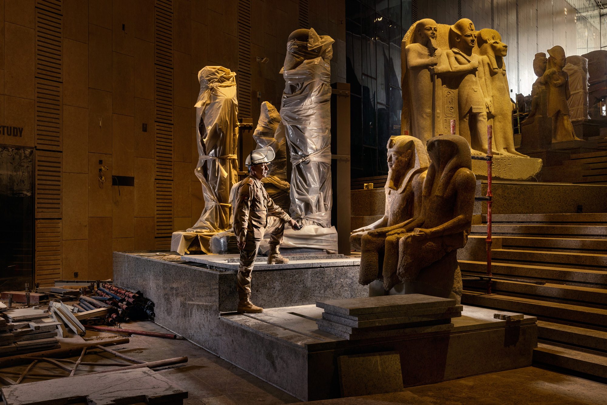 workers preserving ancient Egyptian statues
