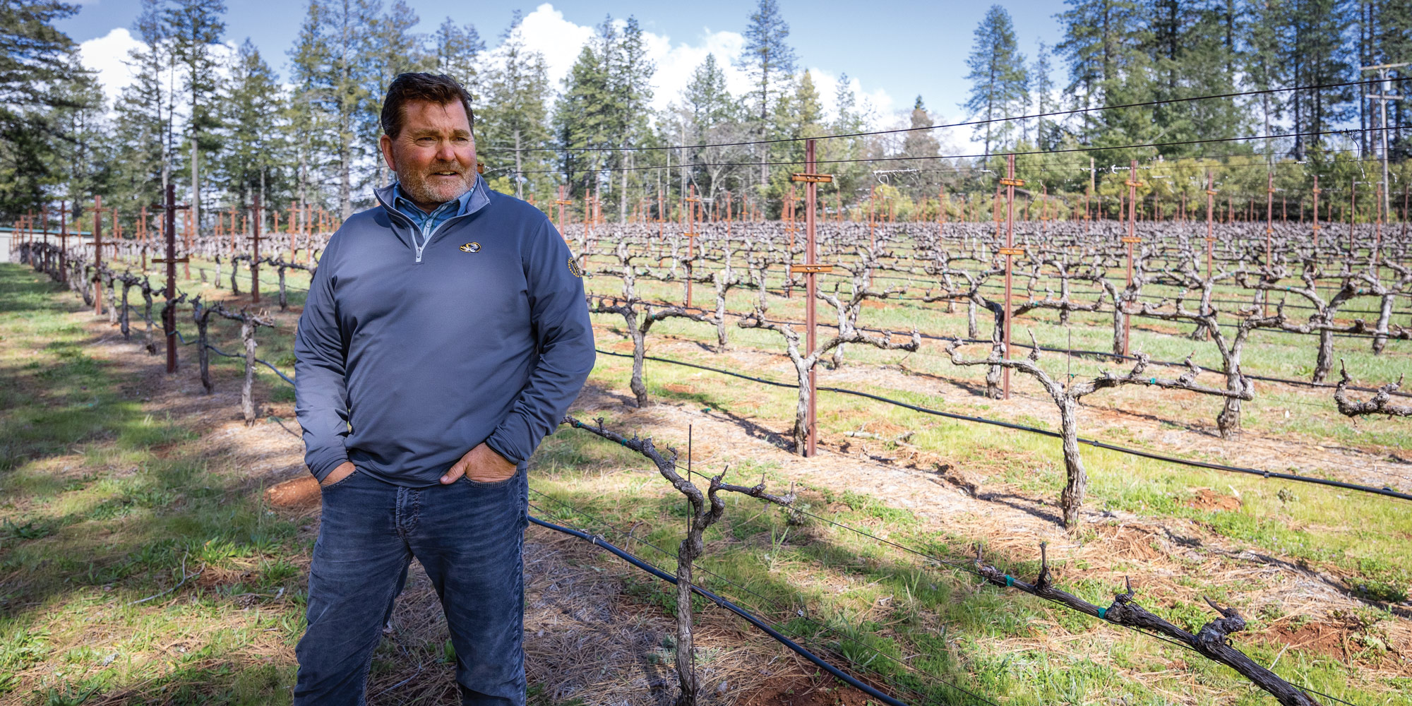 Dave Spence standing in vineyard