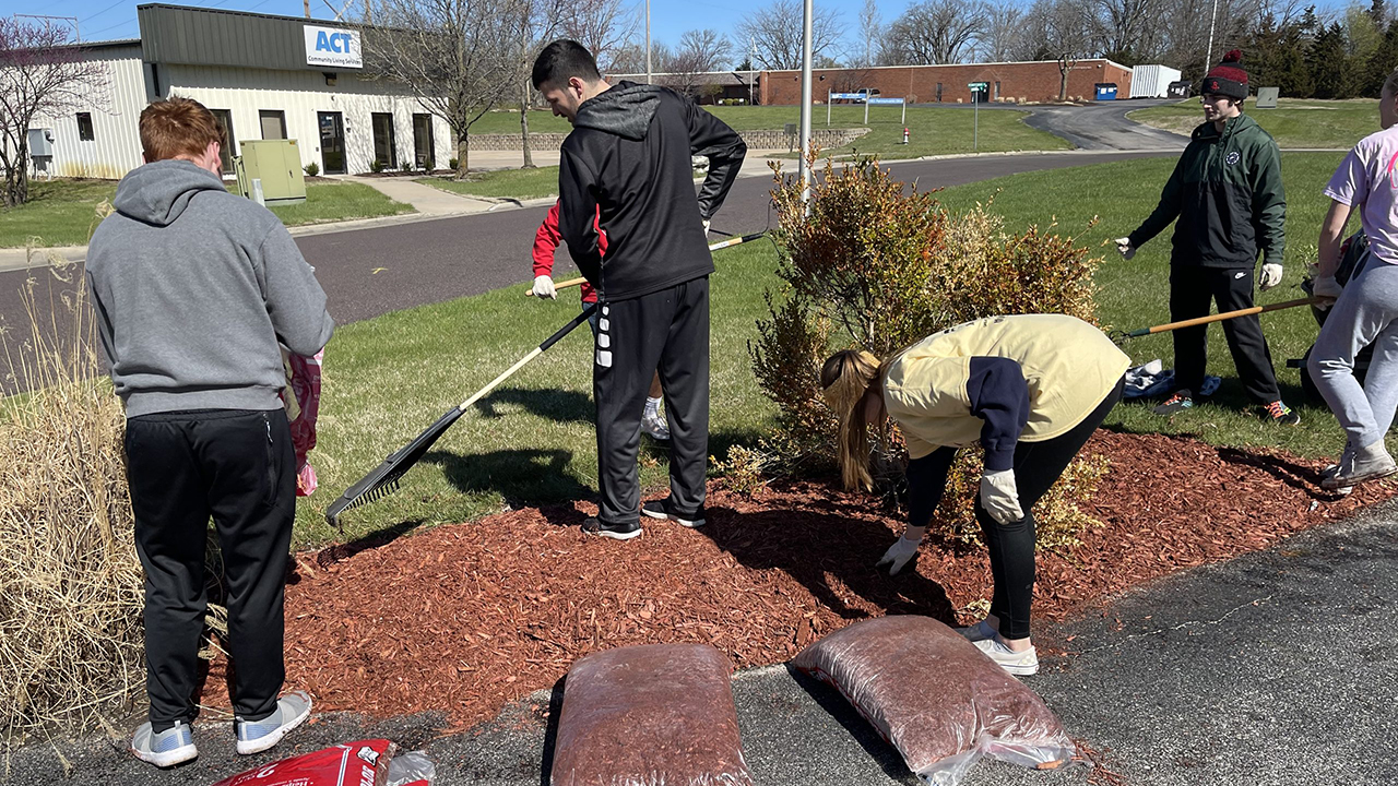 MU students spread mulch during Caring for Columbia in 2022.
