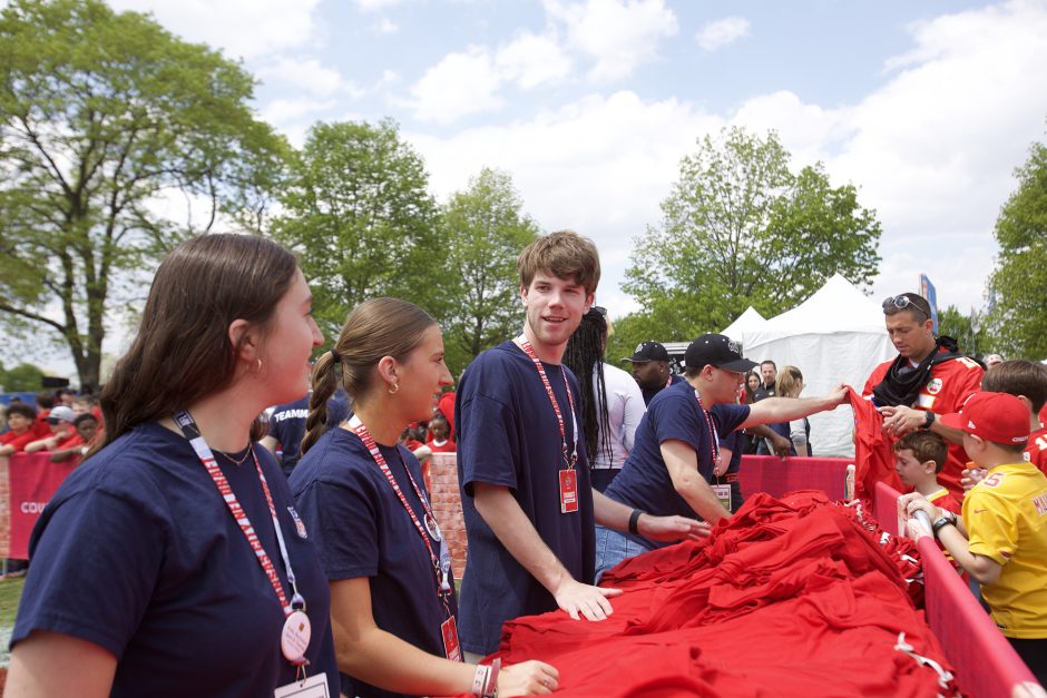 Tyler Magdziak chats with classmates at the T-shirt table