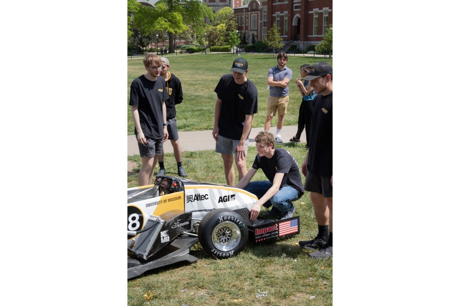 Students working on a Formula SAE car
