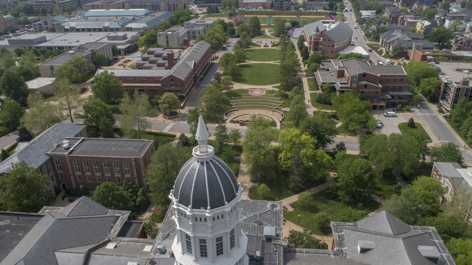 Drone aerial coverage of the oak trees and commencement banners on the David R. Francis Quadrangle