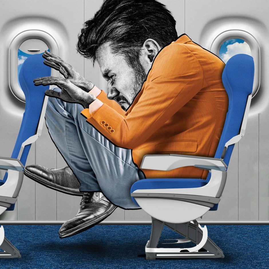 man in cramped airline seat