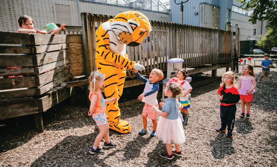 Truman the Tiger with children