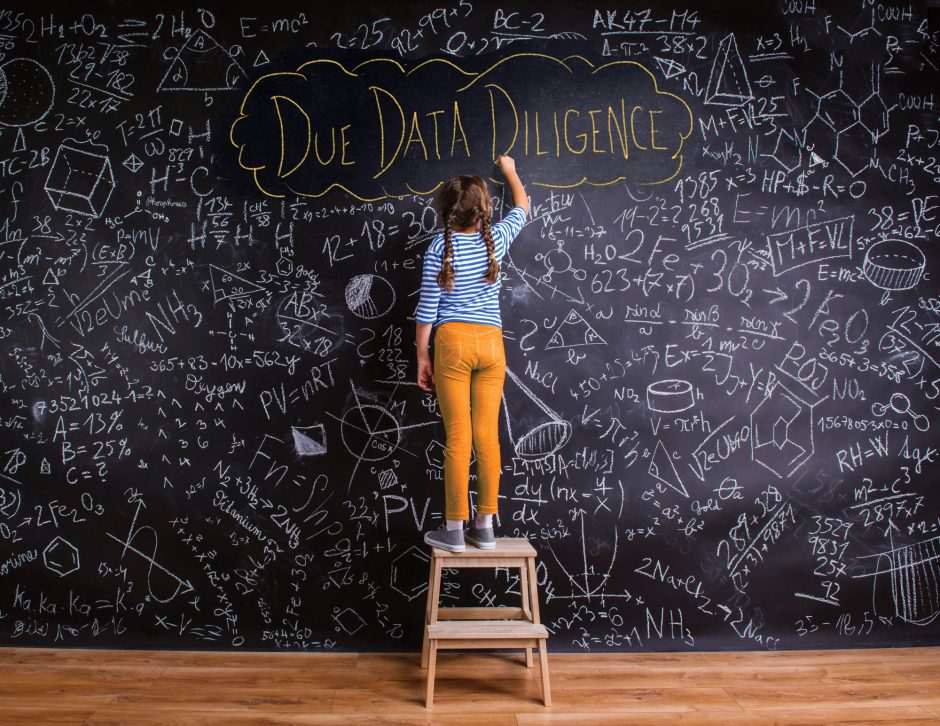 girl writing on chalkboard