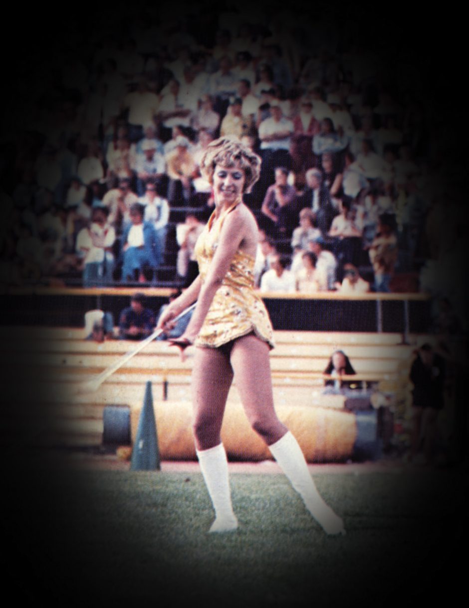 Anna Marie Vaughn twirling baton at football game