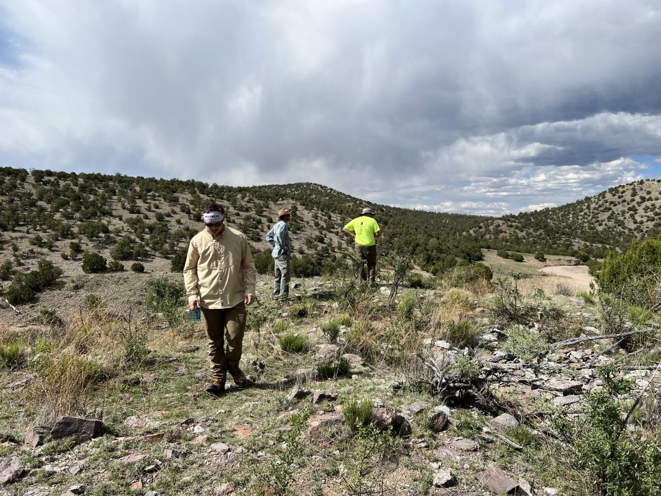 Researchers examining the ground during a process known as "ground truthing" in New Mexico.