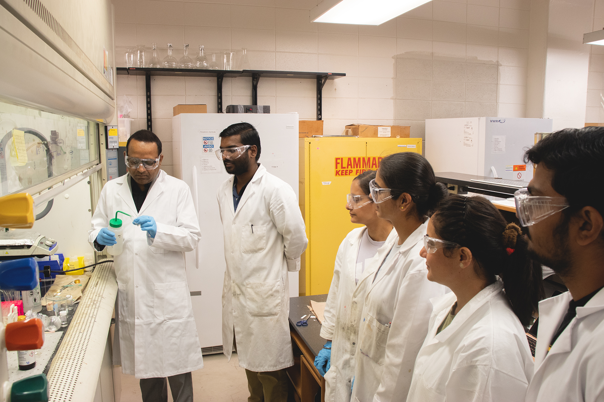 six people working in a lab environment