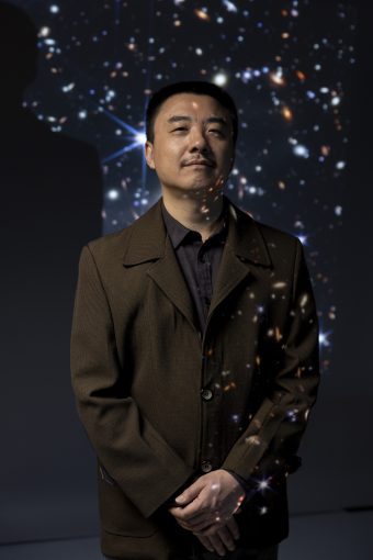 Portrait of Haojing Yan with galaxy background