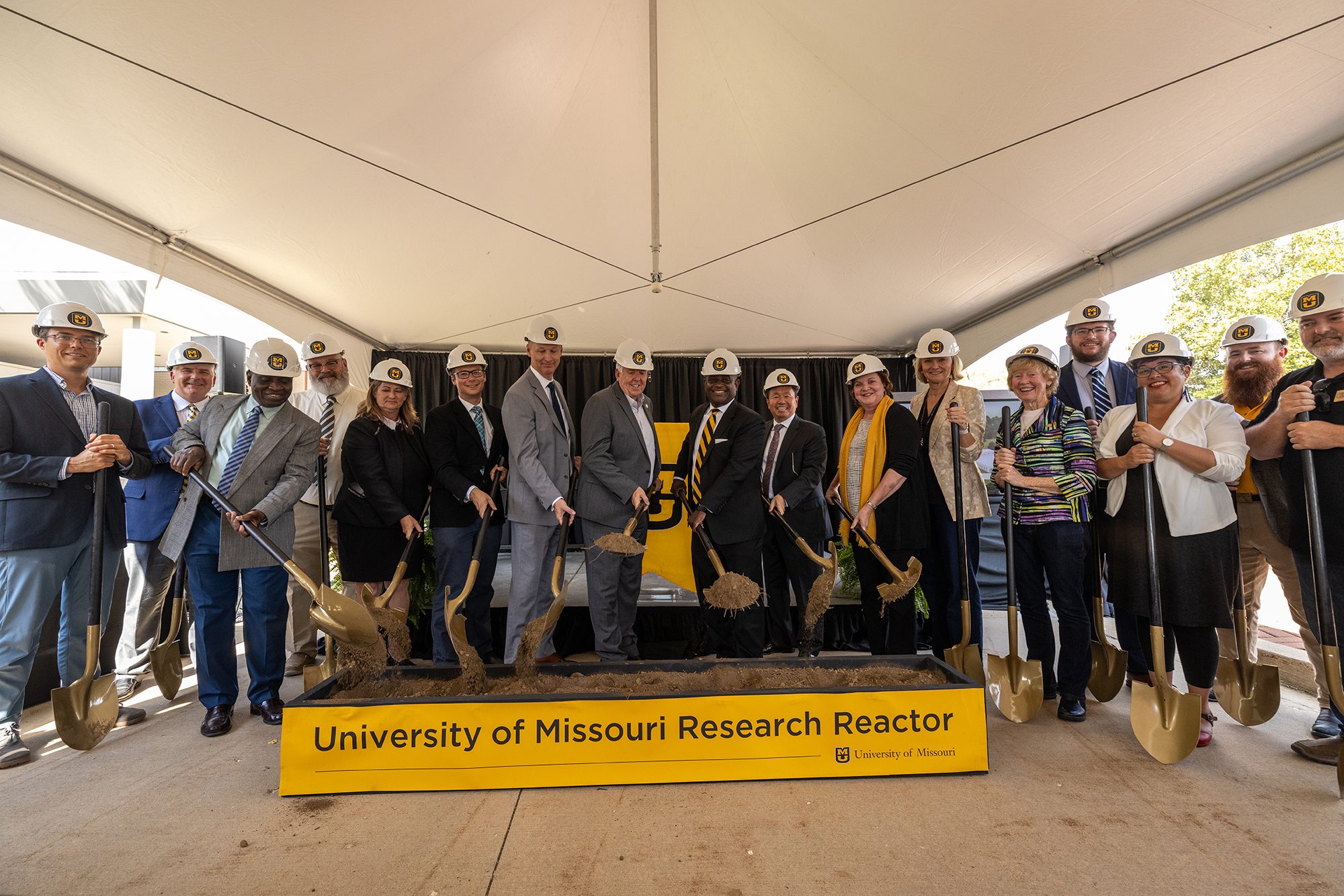 University of Missouri leaders and partners perform a ceremonial dirt turn during the groundbreaking ceremony for MURR West.