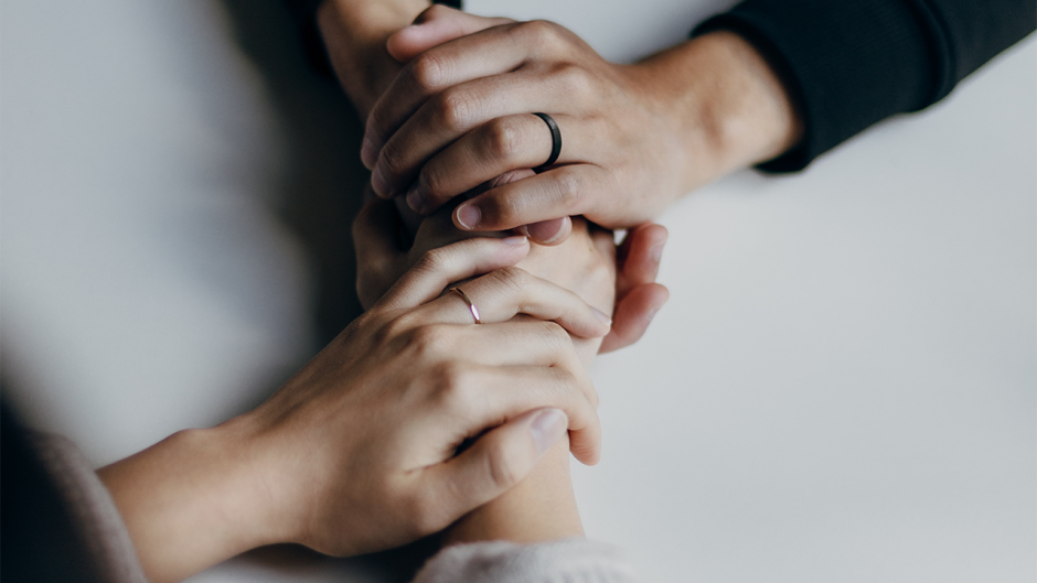 Two people holding hands.