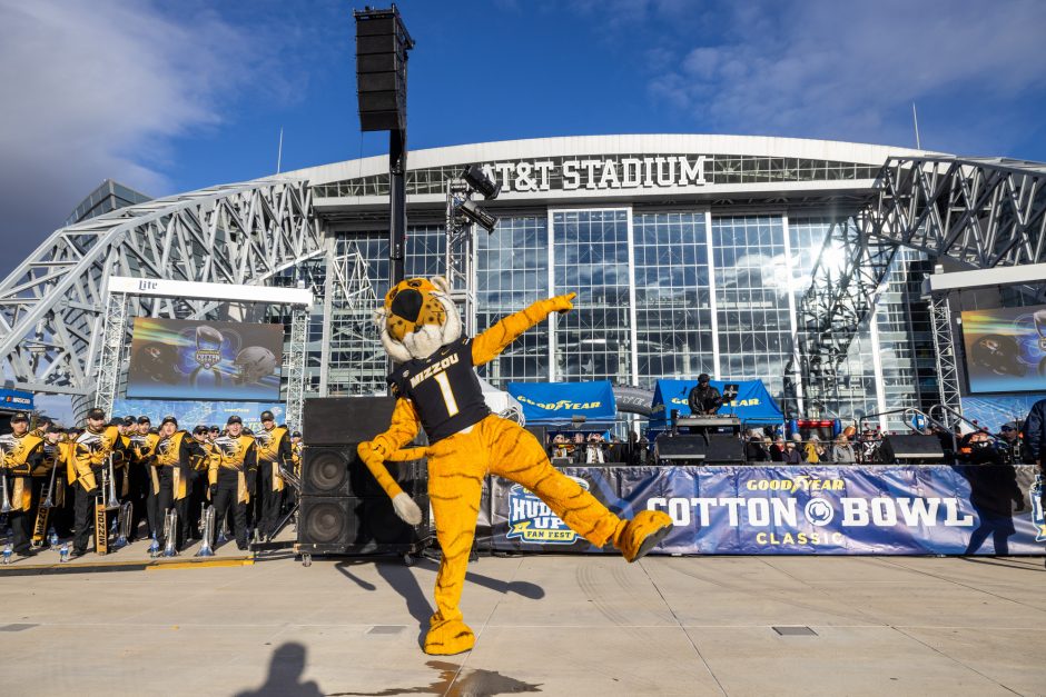 Truman cheers at Battle of the Bands at AT&T Stadium in anticipation of the Cotton Bowl.