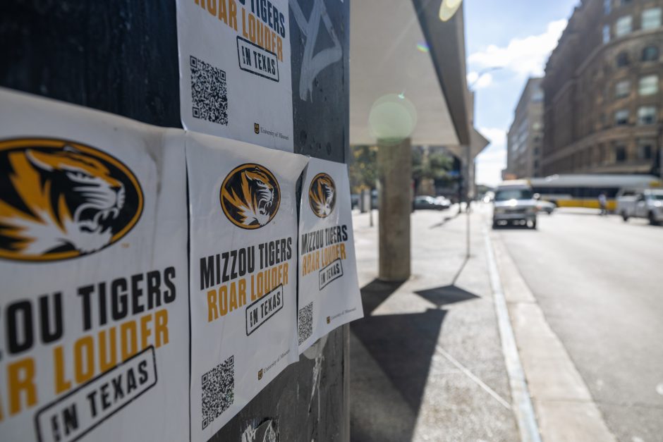 Mizzou Tigers Roar Louder signs on a building in Dallas.